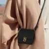 Numéro Sept Crossbody-portemonnee-editie, zwart met textuur
