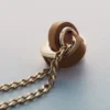 Ormé-ketting, vergulde editie met kamelenleer
